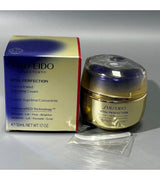 Shiseido Vital Perfection Concentrated Supreme Cream 50ml jar next to its original blue and gold packaging box, with a small plastic applicator wand in front, on a gray background.